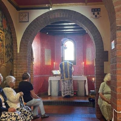 At the St. John Vianney altar